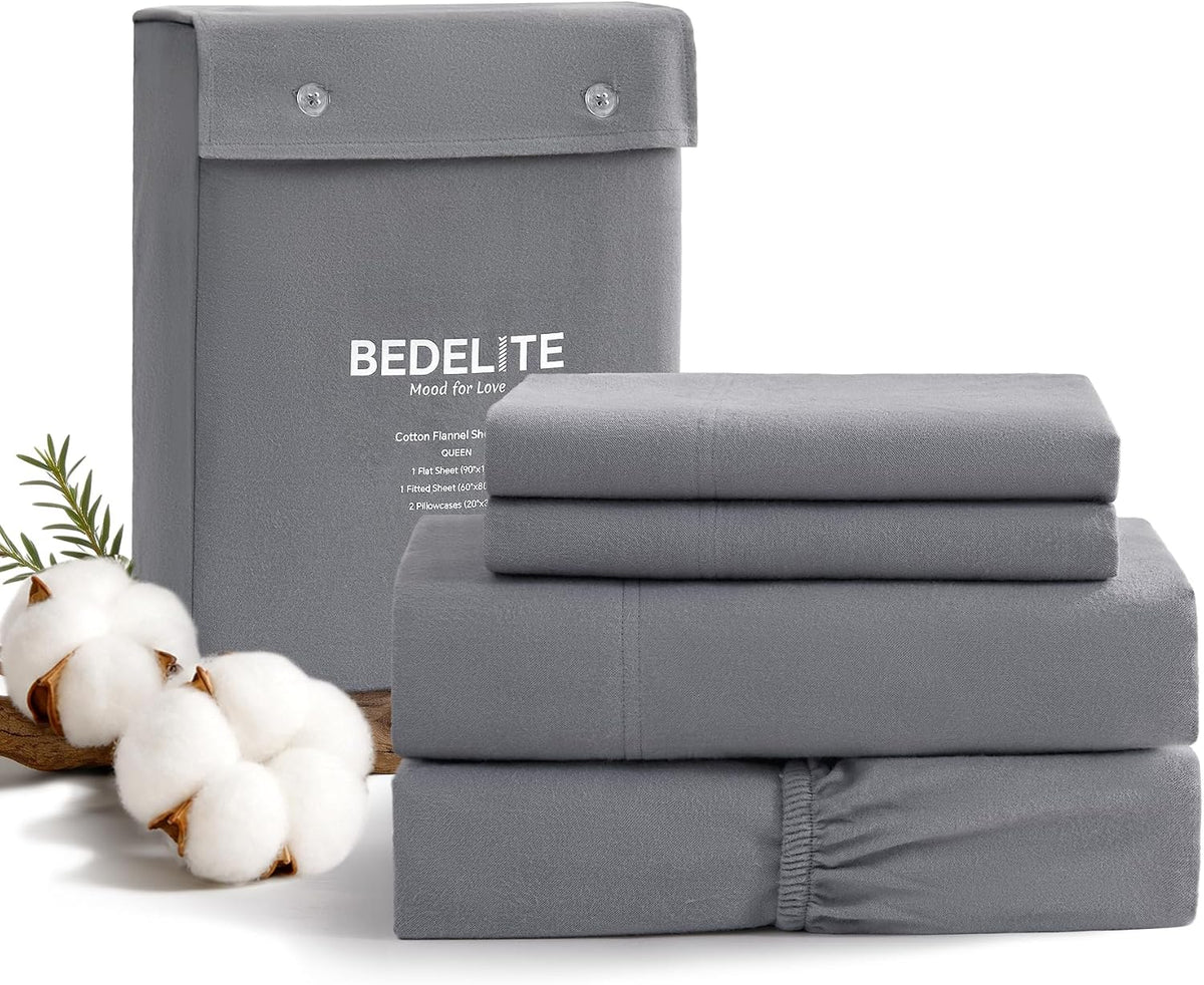 Gray folded bed sheet set with BEDELITE packaging on a white background